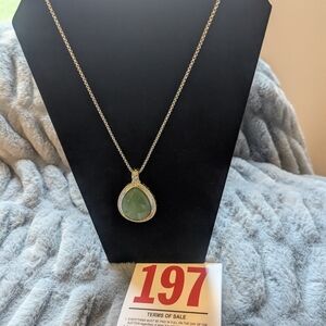 Lot 197  Necklace with a Silvertone Chain and a Green Pendant